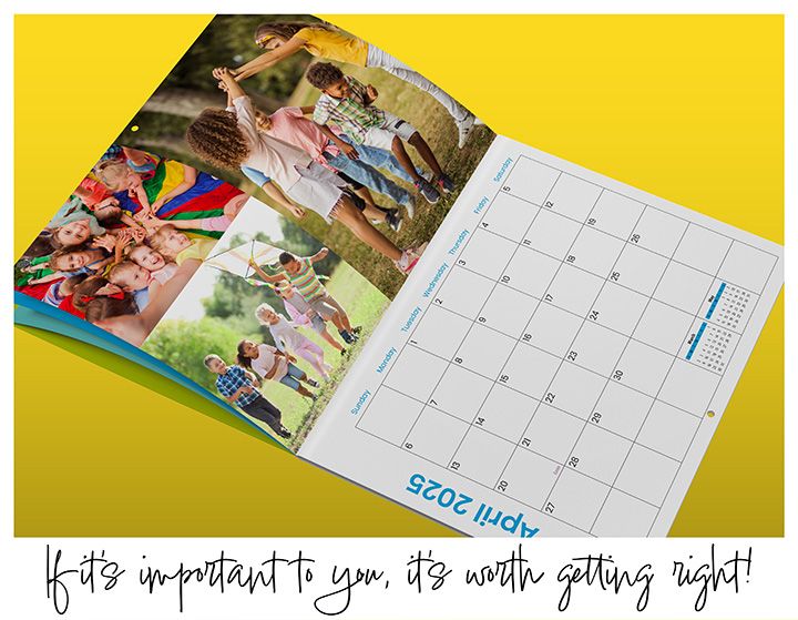 Open 2025 wall calendar showing April, featuring vibrant images of children playing outdoors, including group activities and a kite-flying scene, against a yellow background.